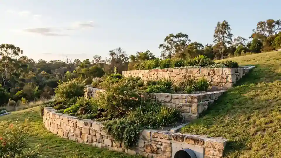 Terraced Gold Coast retaining wall system stepping down a landscaped slope